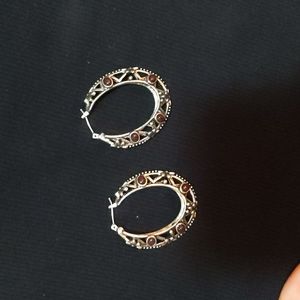 Hoop earrings with dark purple stones